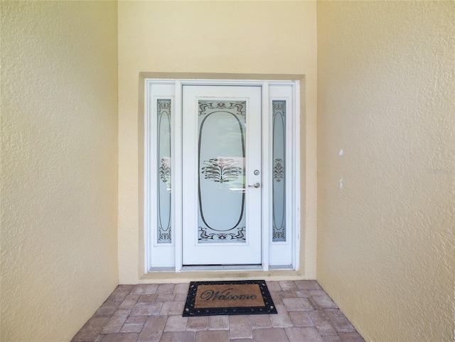 21590 SW 84th Loop, Dunnellon, FL 34431 - view of exterior entry with stucco siding