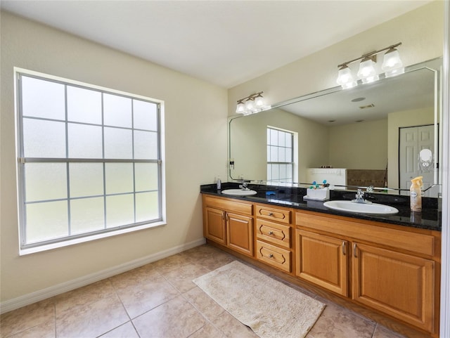 21590 SW 84th Loop, Dunnellon, FL 34431 - bathroom with double vanity and tile patterned floors