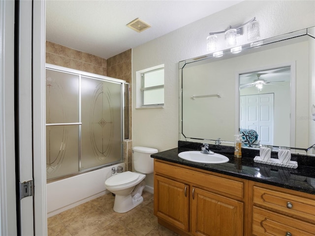 21590 SW 84th Loop, Dunnellon, FL 34431 - full bath with vanity, combined bath / shower with glass door, a ceiling fan, and tile patterned floors