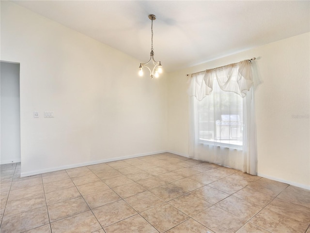 21590 SW 84th Loop, Dunnellon, FL 34431 - empty room with vaulted ceiling, light tile patterned floors, and a chandelier