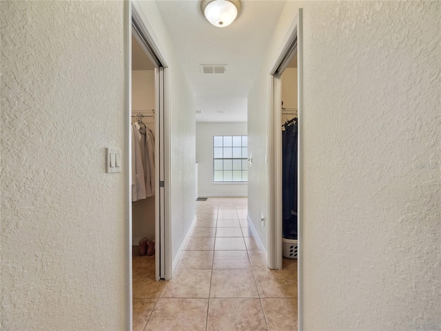 21590 SW 84th Loop, Dunnellon, FL 34431 - hall with a textured wall and light tile patterned floors