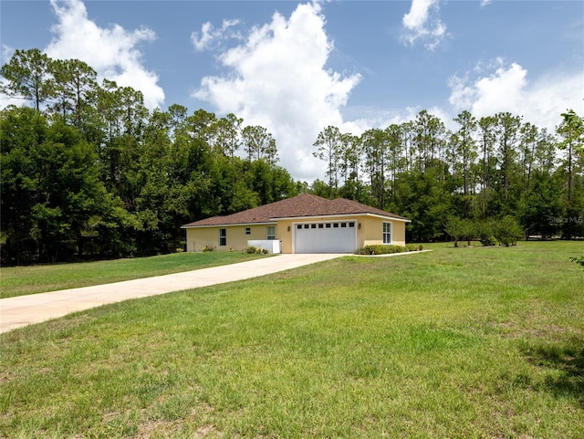 21590 SW 84th Loop, Dunnellon, FL 34431 - ranch-style home with a garage, driveway, a front yard, and stucco siding