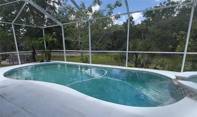 1247 Gentilly Ln, Wesley Chapel, FL 33544 - swimming pool with a lanai and a patio area