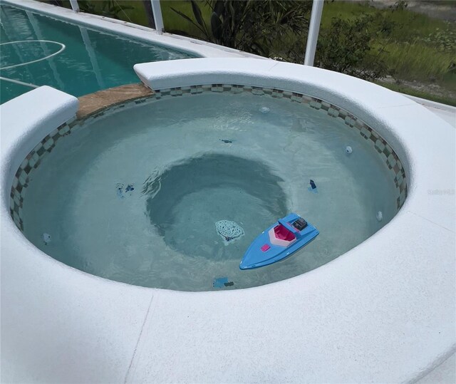 1247 Gentilly Ln, Wesley Chapel, FL 33544 - exterior view of a jacuzzi and a swimming pool