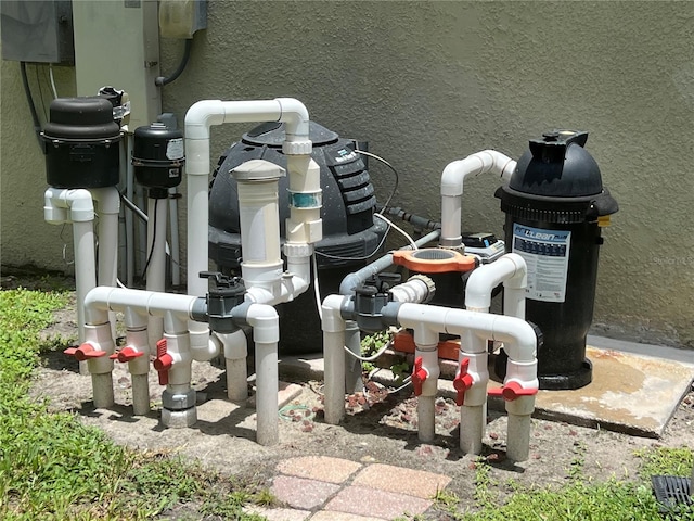 1247 Gentilly Ln, Wesley Chapel, FL 33544 - exterior view of stucco siding and pump