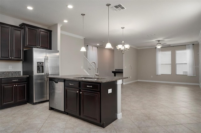 4146 Bexley Village Dr, Land O Lakes, FL 34638 - kitchen featuring appliances with stainless steel finishes, a ceiling fan, an island with sink, crown molding, and light tile patterned floors