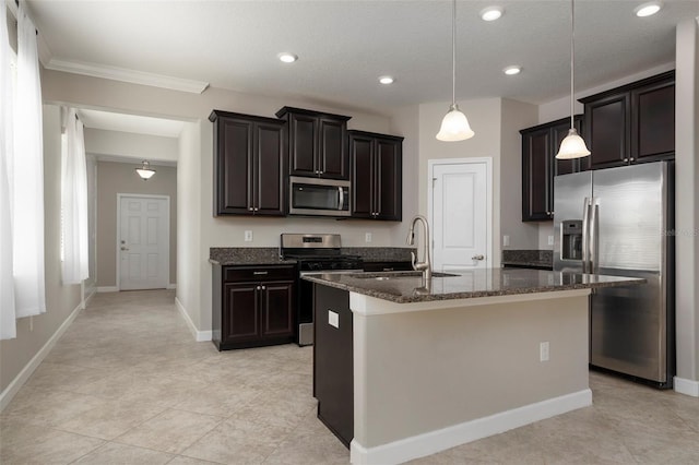 4146 Bexley Village Dr, Land O Lakes, FL 34638 - kitchen with appliances with stainless steel finishes, dark stone counters, a kitchen island with sink, pendant lighting, and light tile patterned floors