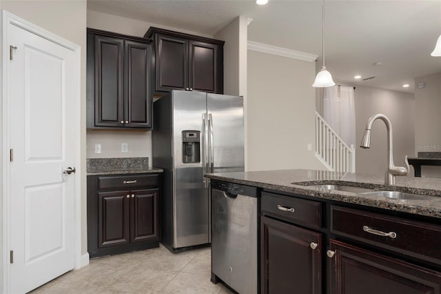 4146 Bexley Village Dr, Land O Lakes, FL 34638 - kitchen with appliances with stainless steel finishes, dark stone counters, crown molding, pendant lighting, and light tile patterned floors