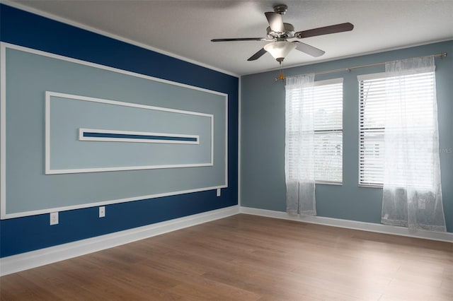 4146 Bexley Village Dr, Land O Lakes, FL 34638 - empty room featuring a ceiling fan and wood finished floors