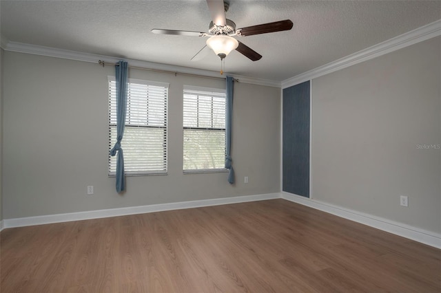 4146 Bexley Village Dr, Land O Lakes, FL 34638 - empty room with ornamental molding, wood finished floors, a textured ceiling, and a ceiling fan