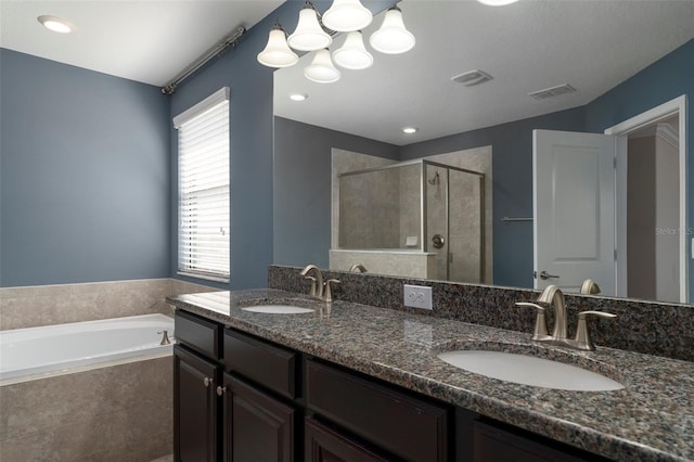4146 Bexley Village Dr, Land O Lakes, FL 34638 - full bathroom featuring a shower stall, a bath, double vanity, and a chandelier