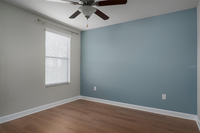 4146 Bexley Village Dr, Land O Lakes, FL 34638 - empty room with dark wood-style flooring and a ceiling fan