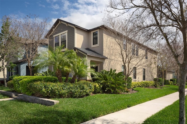 4146 Bexley Village Dr, Land O Lakes, FL 34638 - view of side of home with stucco siding and a yard