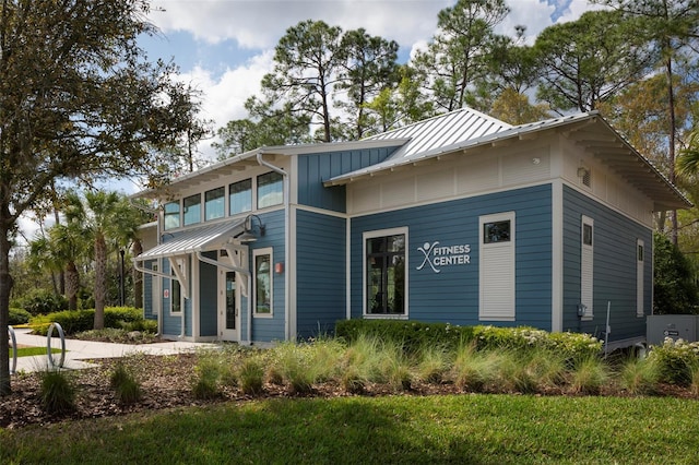 4146 Bexley Village Dr, Land O Lakes, FL 34638 - view of front facade with a standing seam roof and a metal roof