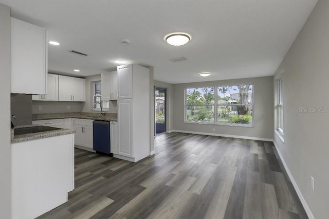 7625 Marechal Ave, Port Richey, FL 34668 - kitchen with dishwasher, white cabinets, dark wood-style floors, recessed lighting, and open floor plan