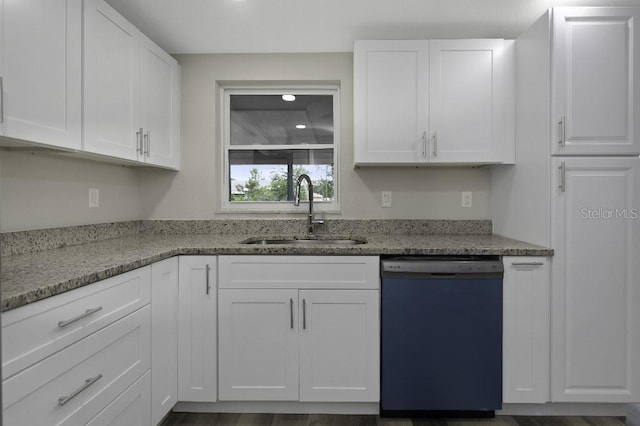 7625 Marechal Ave, Port Richey, FL 34668 - kitchen with dishwashing machine, white cabinetry, light stone counters, and recessed lighting