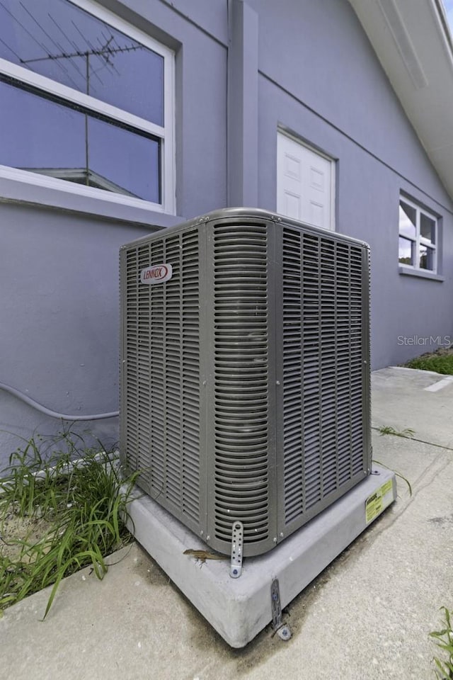 7625 Marechal Ave, Port Richey, FL 34668 - exterior view of a central AC unit and stucco siding