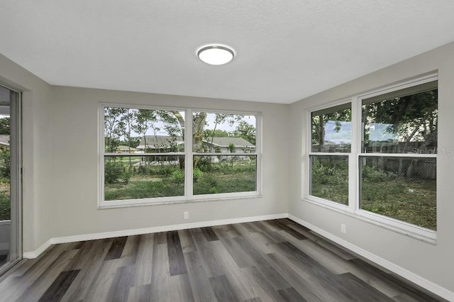 7625 Marechal Ave, Port Richey, FL 34668 - unfurnished sunroom with healthy amount of natural light and wood finished floors