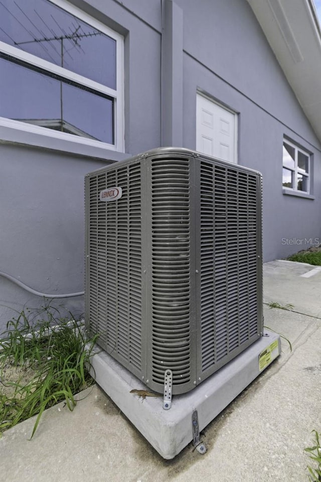 7625 Marechal Ave, Port Richey, FL 34668 - exterior view of a central AC unit and stucco siding