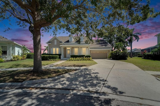 5205 Brighton Shore Dr, Apollo Beach, FL 33572 - traditional-style home featuring an attached garage, a front lawn, and driveway