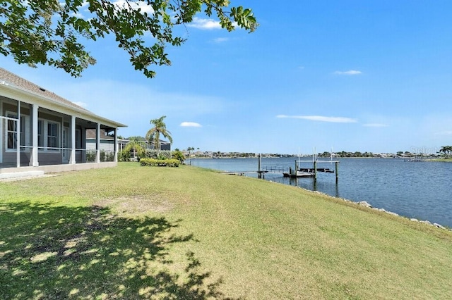 5205 Brighton Shore Dr, Apollo Beach, FL 33572 - view of grassy yard featuring a water view, a dock, and a sunroom