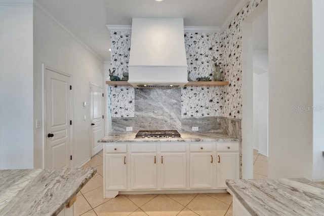 5205 Brighton Shore Dr, Apollo Beach, FL 33572 - kitchen featuring custom exhaust hood, open shelves, stainless steel gas stovetop, crown molding, and backsplash