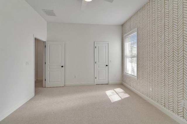 5205 Brighton Shore Dr, Apollo Beach, FL 33572 - unfurnished bedroom featuring light carpet and a ceiling fan