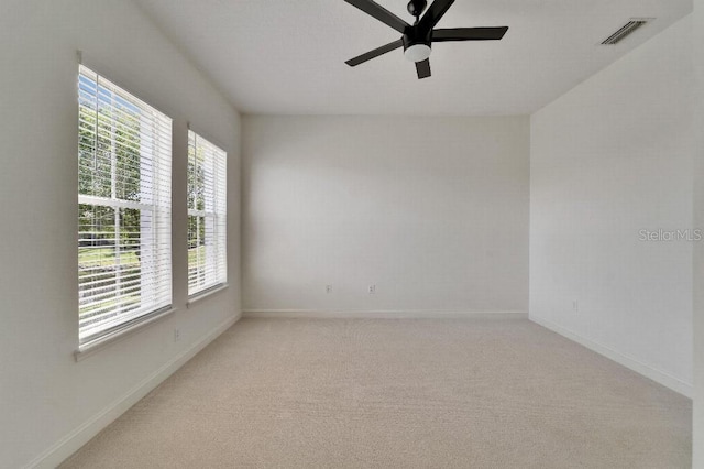 5205 Brighton Shore Dr, Apollo Beach, FL 33572 - spare room with a ceiling fan and light colored carpet