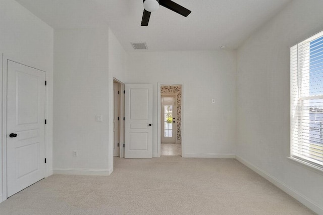 5205 Brighton Shore Dr, Apollo Beach, FL 33572 - unfurnished bedroom featuring light carpet and ceiling fan