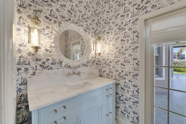5205 Brighton Shore Dr, Apollo Beach, FL 33572 - bathroom featuring wallpapered walls and vanity