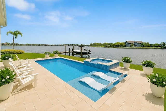 5205 Brighton Shore Dr, Apollo Beach, FL 33572 - view of swimming pool featuring a water view, a pool with connected hot tub, a dock, boat lift, and a patio