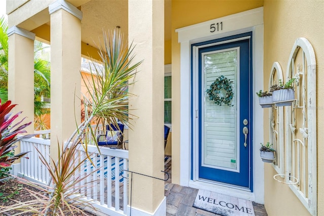 511 Winterside Dr, Apollo Beach, FL 33572 - entrance to property with stucco siding and covered porch