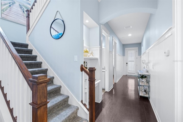 511 Winterside Dr, Apollo Beach, FL 33572 - entrance foyer with arched walkways, dark wood-style floors, and stairs