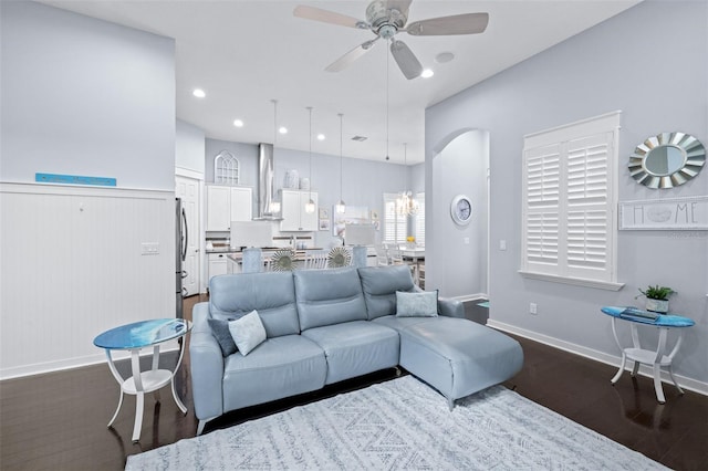 511 Winterside Dr, Apollo Beach, FL 33572 - living room with dark wood-type flooring, ceiling fan, and arched walkways