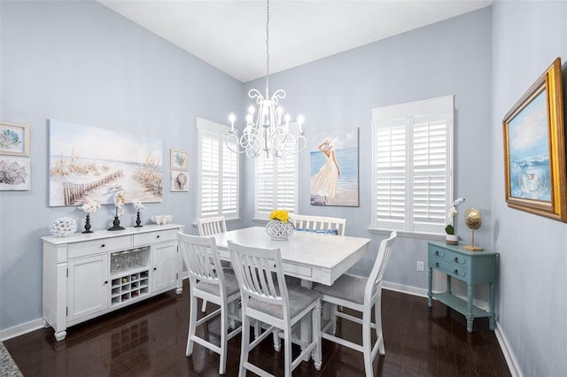 511 Winterside Dr, Apollo Beach, FL 33572 - dining room with dark wood-style flooring and a chandelier