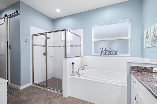 511 Winterside Dr, Apollo Beach, FL 33572 - full bathroom with a garden tub, a stall shower, tile patterned flooring, and vanity