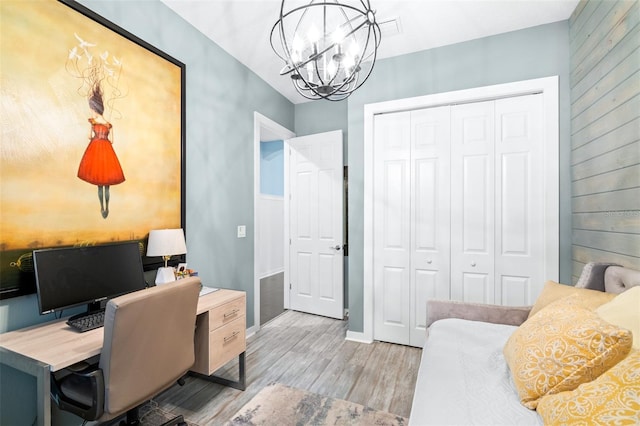 511 Winterside Dr, Apollo Beach, FL 33572 - office area with wood finished floors, a chandelier, and wood walls