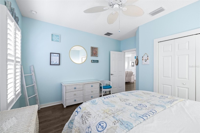 511 Winterside Dr, Apollo Beach, FL 33572 - bedroom with dark wood-style floors, a closet, and a ceiling fan