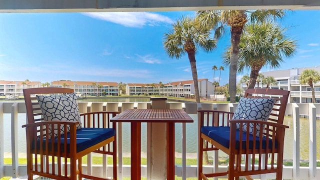 12132 Capri Cir S, Treasure Island, FL 33706 - wooden terrace featuring a residential view and a water view