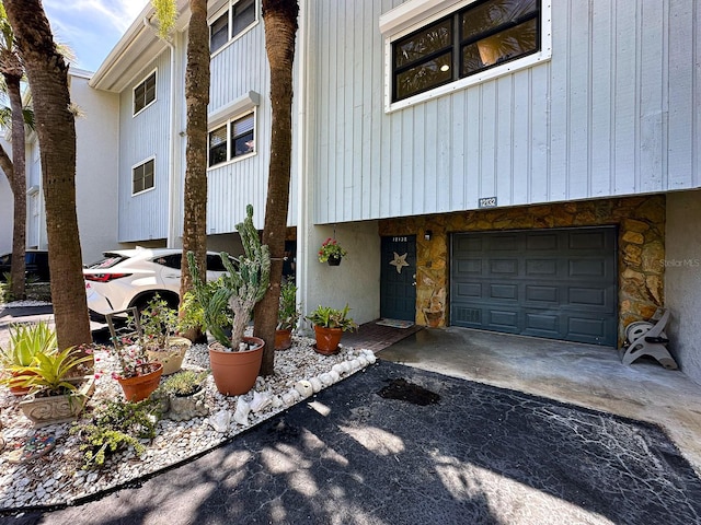 12132 Capri Cir S, Treasure Island, FL 33706 - entrance to property with asphalt driveway and an attached garage