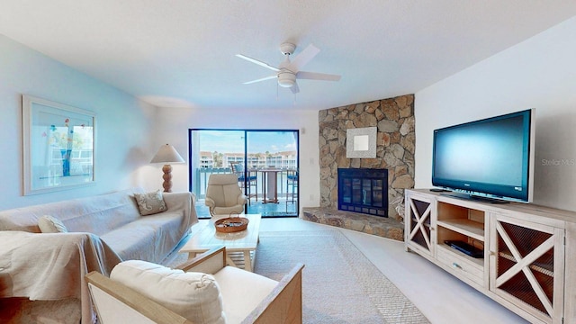 12132 Capri Cir S, Treasure Island, FL 33706 - living area featuring a ceiling fan and a fireplace