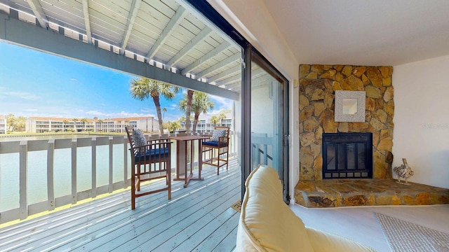 12132 Capri Cir S, Treasure Island, FL 33706 - wooden deck featuring a water view
