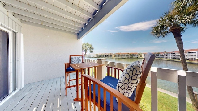 12132 Capri Cir S, Treasure Island, FL 33706 - wooden terrace featuring a water view