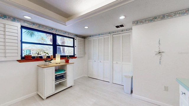 12132 Capri Cir S, Treasure Island, FL 33706 - unfurnished bedroom featuring recessed lighting and light wood-style flooring