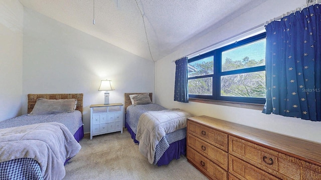 12132 Capri Cir S, Treasure Island, FL 33706 - bedroom featuring light carpet, lofted ceiling, and a textured ceiling
