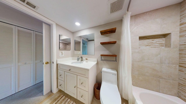 12132 Capri Cir S, Treasure Island, FL 33706 - full bath with vanity, shower / bathtub combination with curtain, and a closet