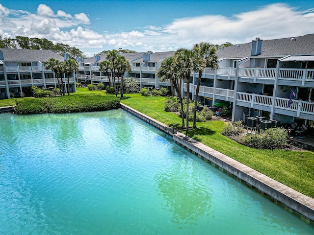 12132 Capri Cir S, Treasure Island, FL 33706 - view of pool featuring a residential view, a yard, and a swimming pool