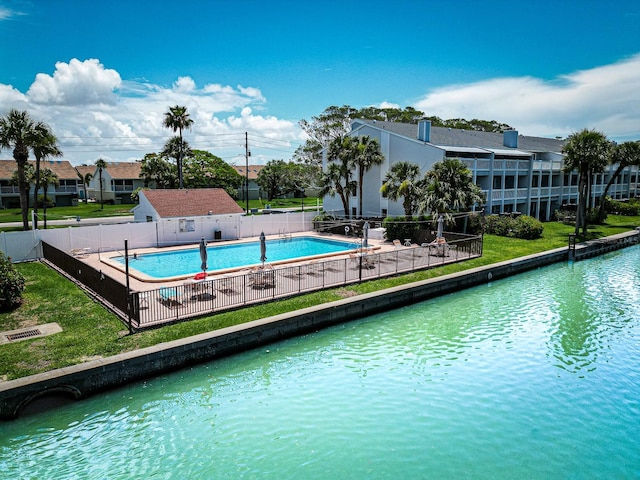 12132 Capri Cir S, Treasure Island, FL 33706 - community pool featuring a water view