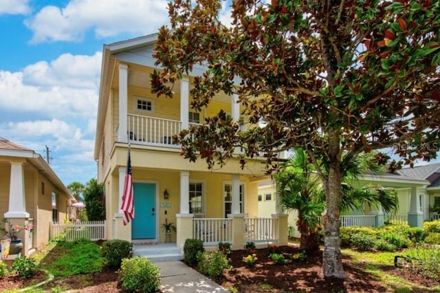 5410 River Sound Ter, Bradenton, FL 34208 - view of front facade featuring covered porch, a balcony, and stucco siding