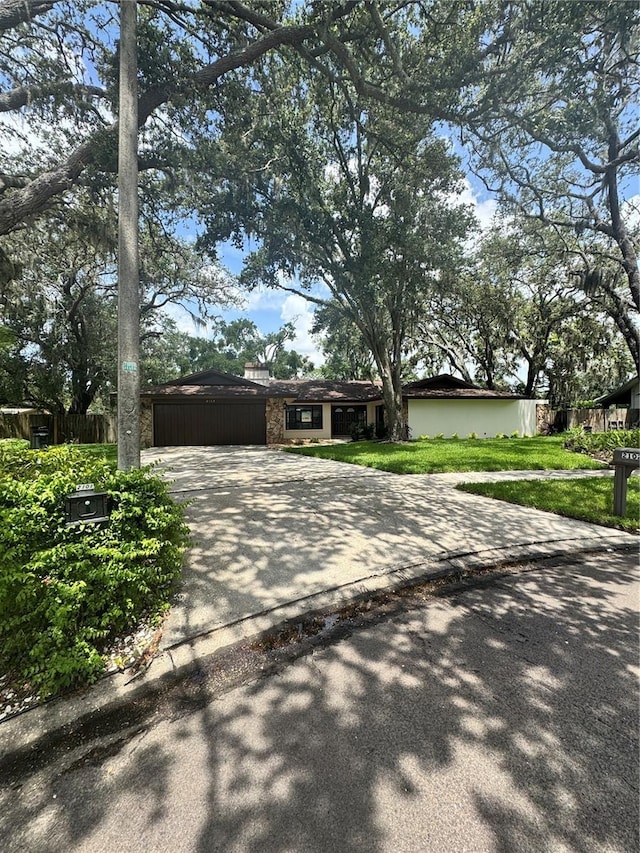 2102 Doefield Ct, Valrico, FL 33596 - view of front of house featuring driveway and a front lawn
